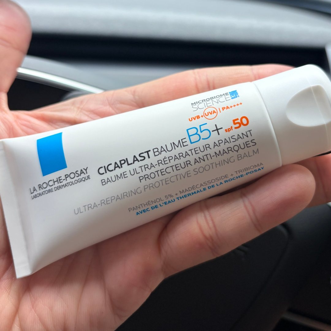La Roche-Posay Cicaplast Baume B5+ SPF 50 held in hand, front label showing SPF 50 and the UVA mark