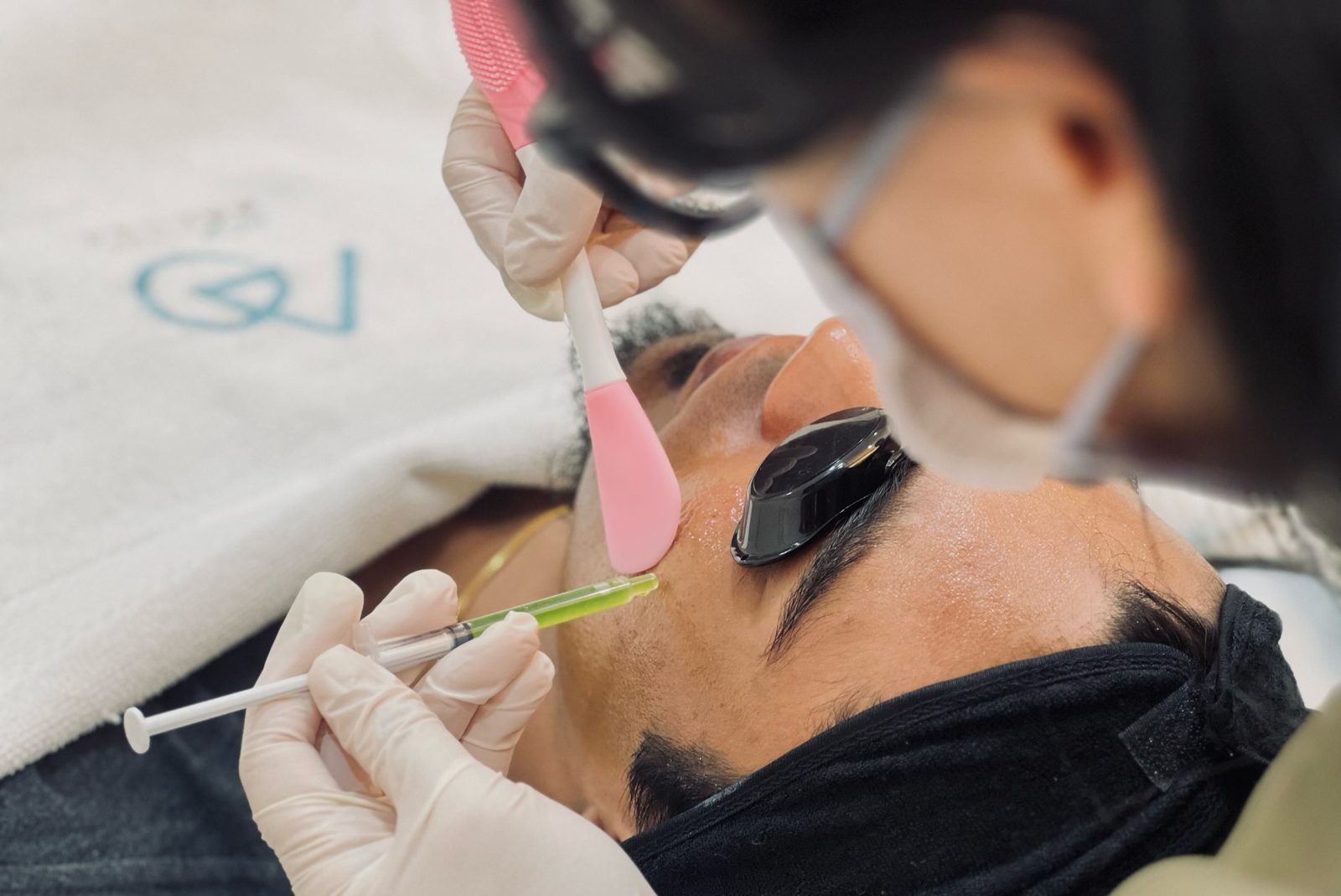 Medical-grade chemical peel in progress with protective eyewear